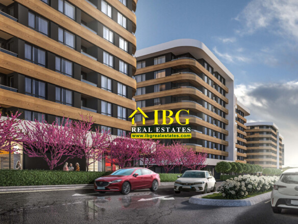 Modern apartment building with curved wooden balconies, lined by pink blossom trees and passing cars on a city street.